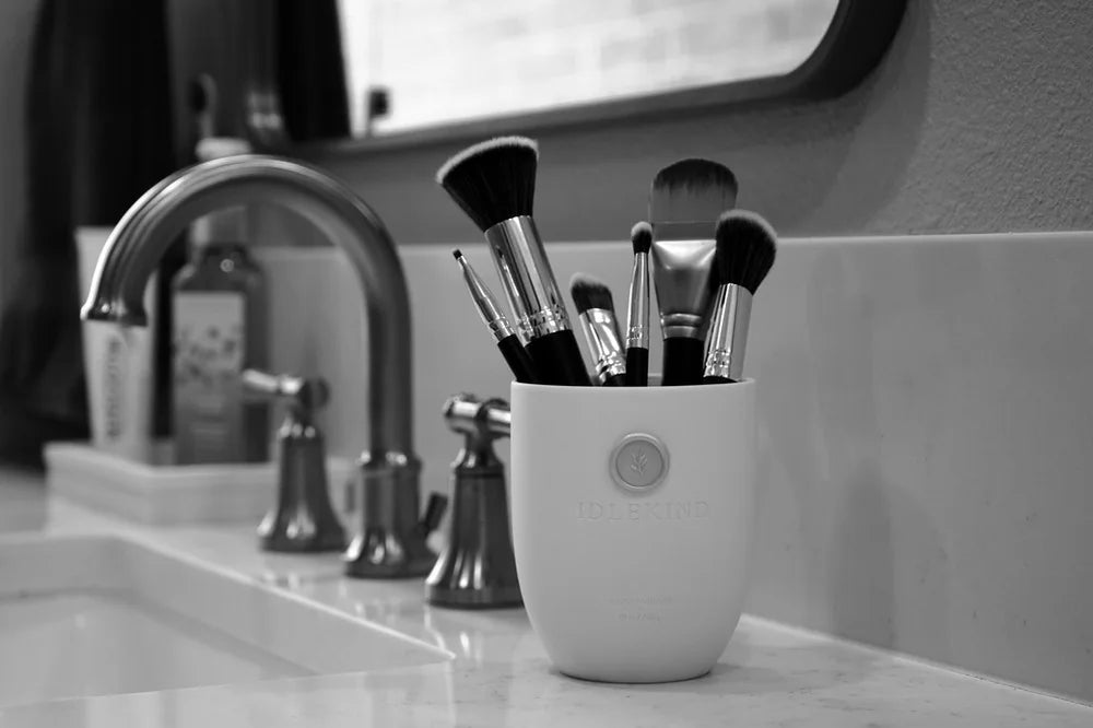 An empty Idlekind vessel holding vanity essentials